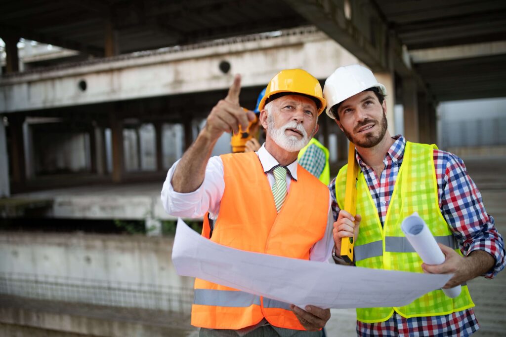 Construction workers holding a blueprint 